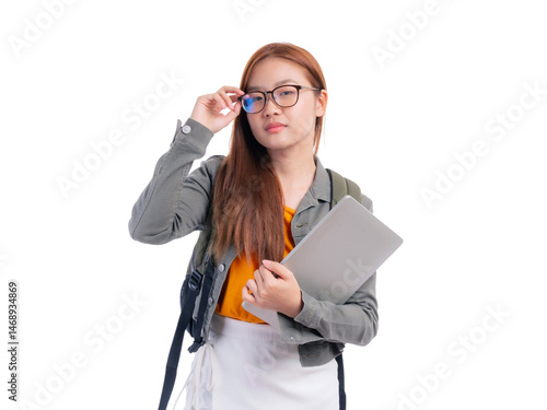 Confident Asian female student wearing glasses holding laptop and backpack, isolated on a transparent background, concept of education, learning, technology and modern lifestyle