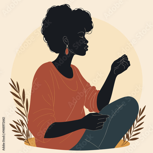 A dark-skinned woman holds her hand against a warm background