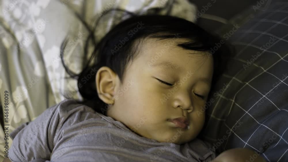 Toddler Taking Nap Time, Background for advertising and wallpaper in relaxion and lifestyle scene. Toddler Taking Nap Time, Background for advertising and wallpaper in relaxion and lifestyle scene.