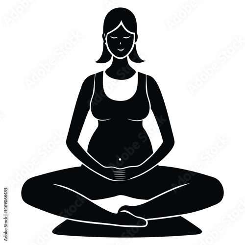 pregnant woman sitting on yoga mat meditating