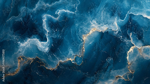 Abstract swirling design featuring deep blues and golds.