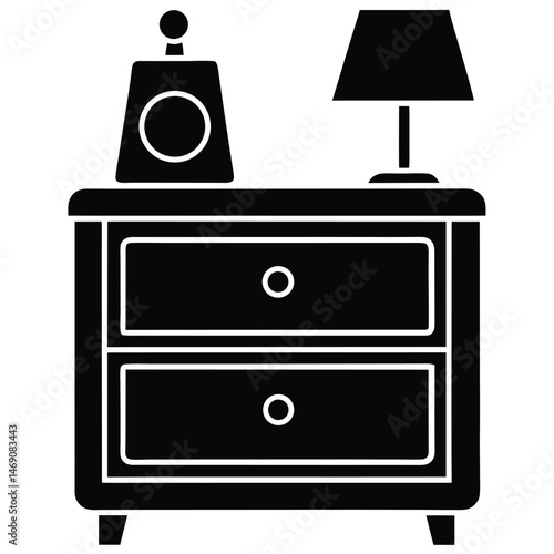 Black bedside table with lamp and decorative bottle creates a minimalistic scene