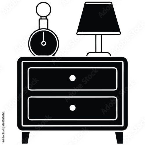 Lamp and clock sit atop twodrawer nightstand outlined in white on a dark backdrop