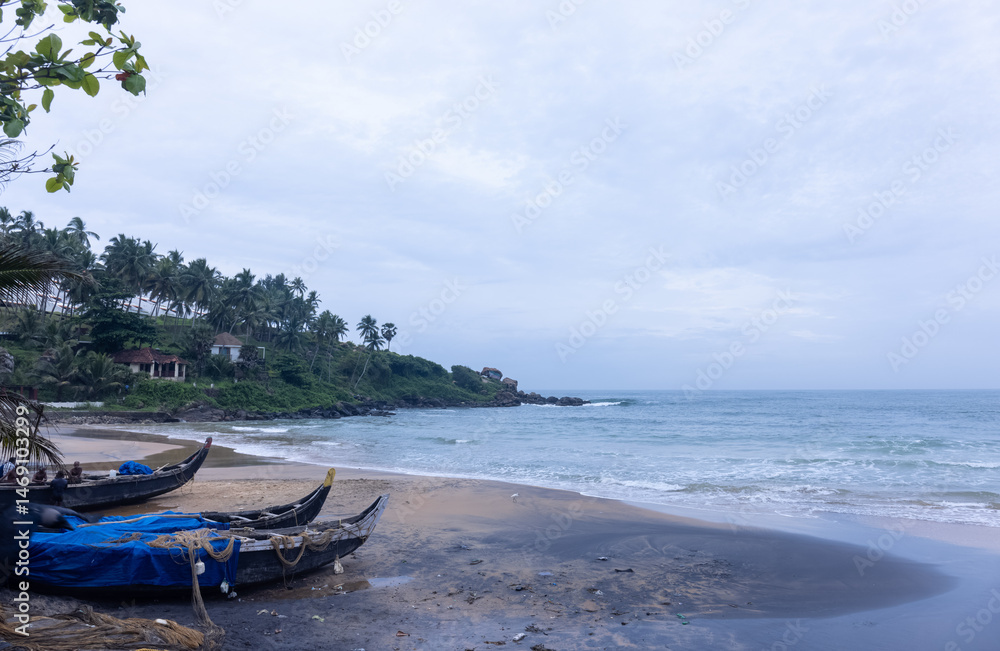 Obraz premium Beach landscape, Beautiful arial view of beach with sea waves and coconut trees and wooden boats. Nature scenery. 