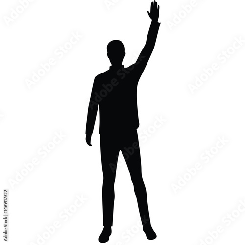 Silhouette of a man stands with one arm raised high above his head