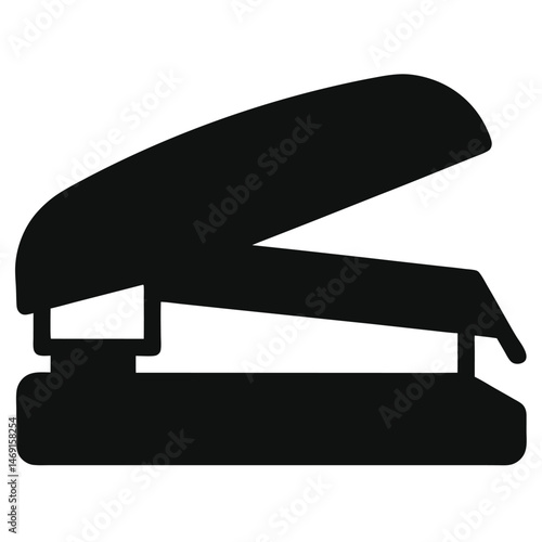 This is an isolated black metal office stapler, a piece of technology used in business and work for fastening paper