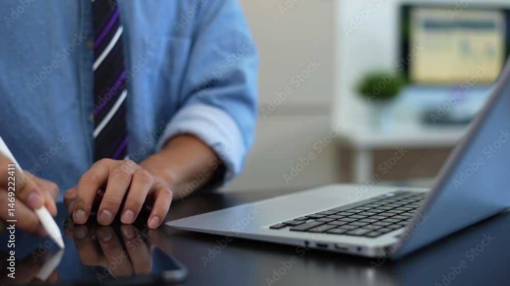 Learning online working concept. Businessman working on tablet and laptop computer, searching working in office.