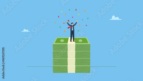 Happy businessman holding winning flag on money banknotes. Reaching financial freedom, investment goal or income target, wealth planning achievement, prosperity or financial independence.