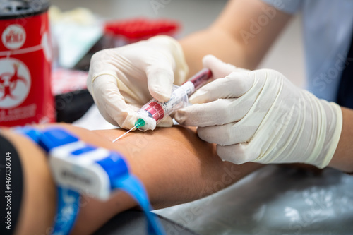 Photography Close up hand of nurse, taking blood sample from a patient in the hospital