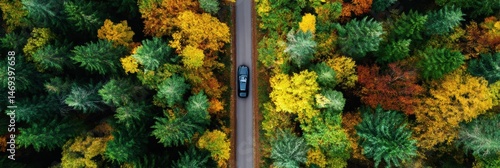 Obraz na płótnie Car Drives Through Autumn Forest Showcasing Vibrant Colors and Peaceful Scenery in an Aerial View Generative AI w salonie