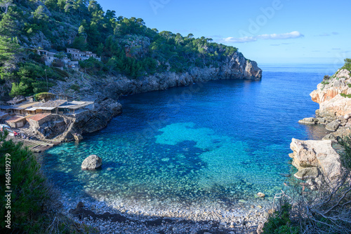 The beach of Deia in the morning light on the island of Mallorca, Spain
