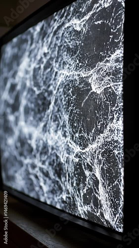 An old tv screen with a broken screen, with a cracked screen