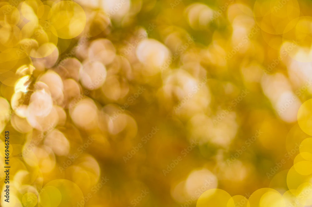 Obraz premium Abstract defocus orange-red background for blank artworks obtained by photographing on a bright sunny day in a summer garden under the foliage of fruit trees. Natural environment with bokeh