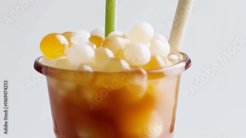 Preparing Sweet Iced Drink With Straw and Tapioca Pearls