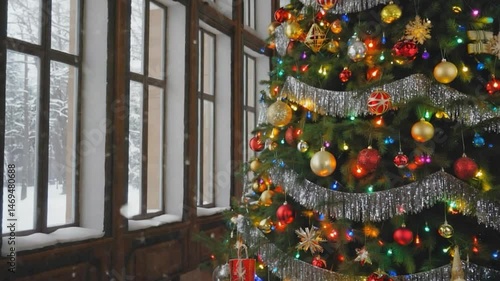 A decorated Christmas tree displays colorful ornaments, bells, and a gold star, embodying the winter holiday celebration
