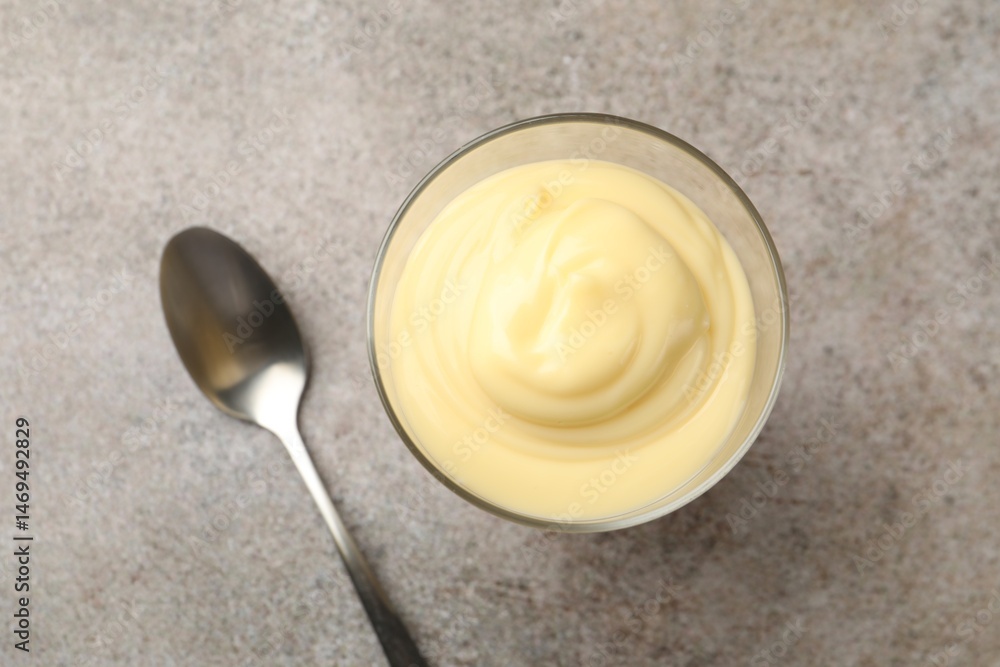 Tasty vanilla pudding served on grey table, top view Tasty vanilla pudding served on grey table, top view