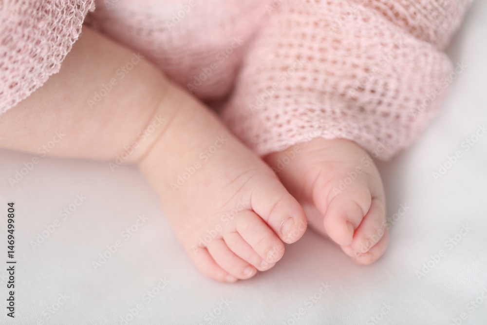 Little baby lying on bed indoors, closeup Little baby lying on bed indoors, closeup
