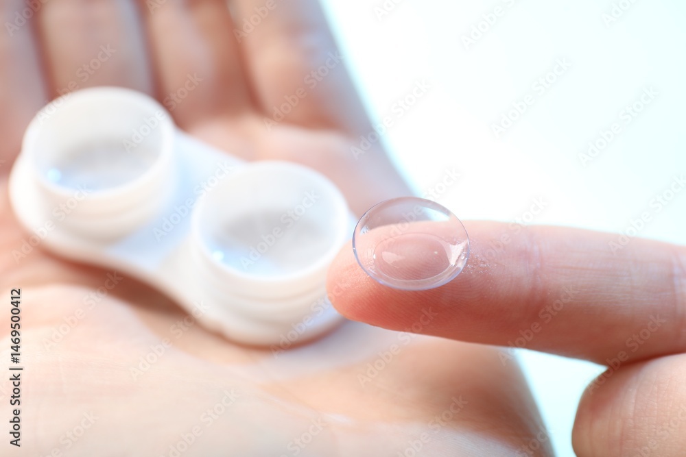 Woman with contact lenses on light background, closeup Woman with contact lenses on light background, closeup