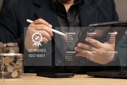 Quality Assurance in Financial Investments and Business Services. man reviewing quality control checklists on a tablet, ensuring service excellence and customer satisfaction. QC PASSED ISO 9001.