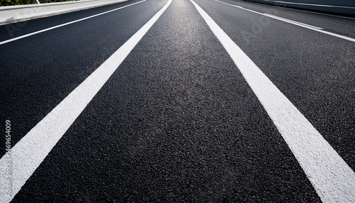 black asphalt road and white dividing lines