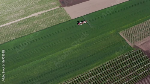 Aerial View of Tractor on Green Field