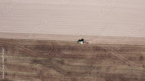 Aerial View of Tractor Plowing Field