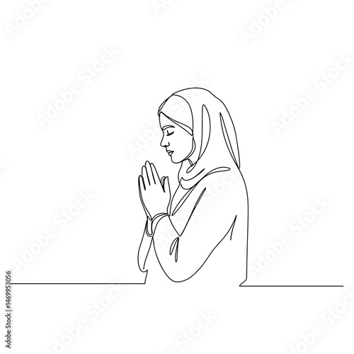 Woman praying with hands clasped in a meditative pose on white background  
