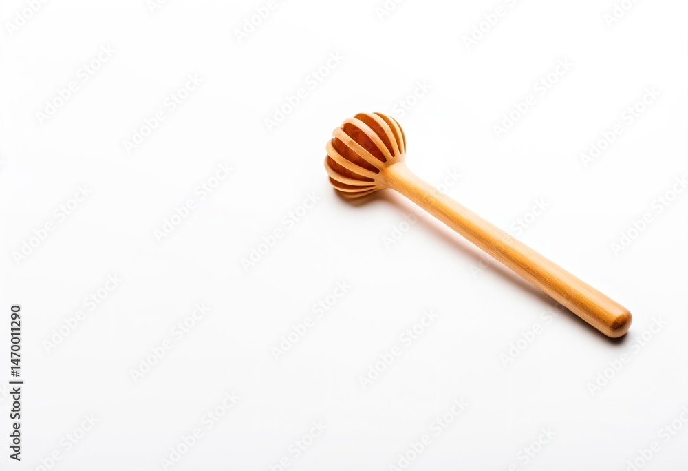 A wooden honey dipper next to a bottle of honey. A wooden honey dipper next to a bottle of honey.