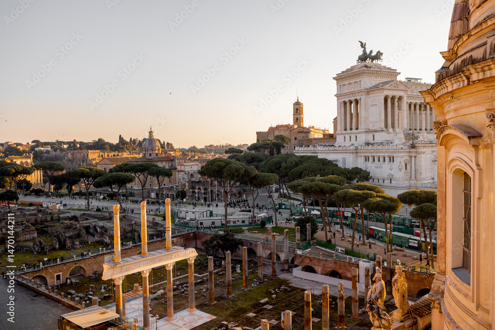 Obraz premium View of Capitoline Hill, Church of Santi Luca e Martina, and the majestic Altare della Patria bathed in golden light, with Roman pines and birds gliding above the rooftops