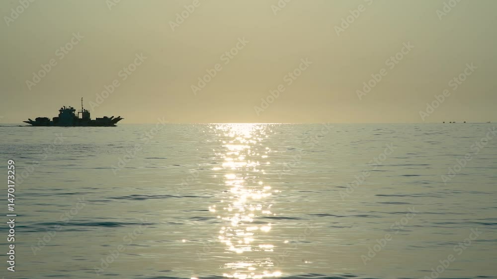 Ships passing over sparkling waters at dusk on a serene ocean Ships passing over sparkling waters at dusk on a serene ocean