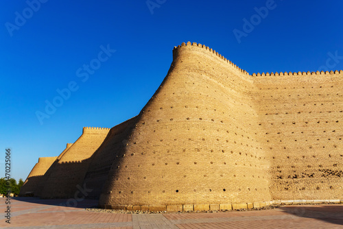 Obraz na plátně Historic fortress walls of the Ark of Bukhara in Uzbekistan under clear blue sky