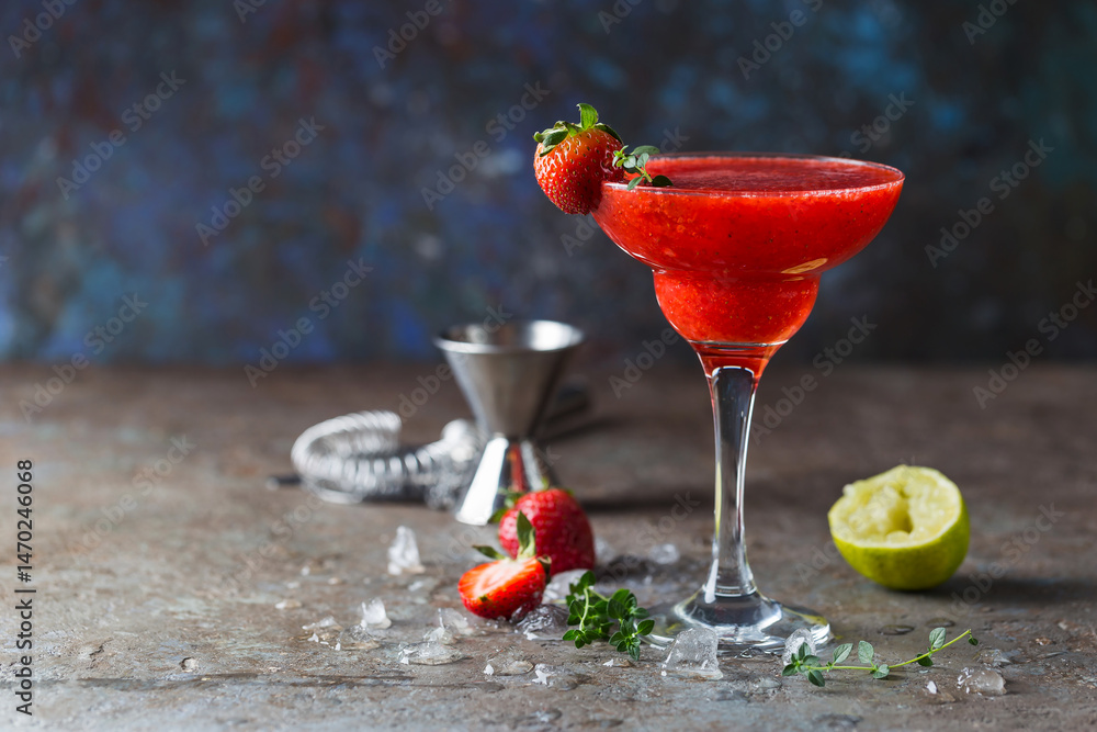 Ice Strawberry alcohol cocktail with lime and rum in a glass