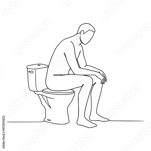 A man sitting on a commode