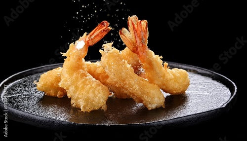 shrimp tempura japanese food isolated on a black background