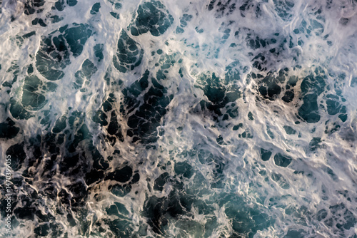 Ocean surface texture. Top view of artistic water with foam. Can be used in covers, packaging, posters, textures, cards, art and design projects. Mesmerizing vector illustration.