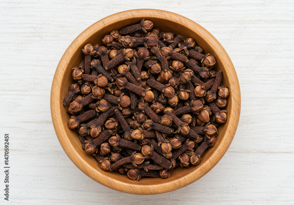 Fototapeta premium Whole Dried Cloves in Bowl – Aromatic Spice for Cooking, Baking, and Herbal Remedies