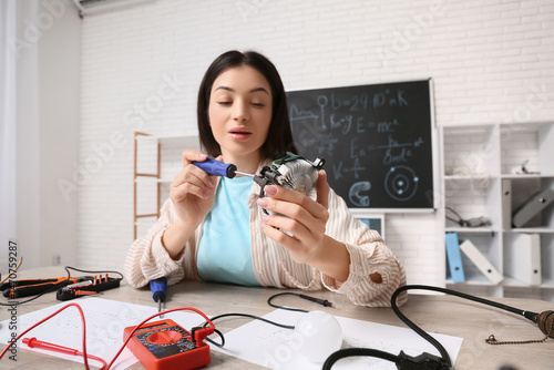 Female inventor with screwd...