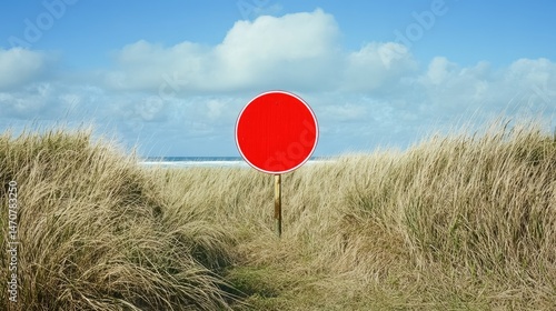 Wallpaper Mural Empty red circle sign amidst golden grasses near ocean. Torontodigital.ca