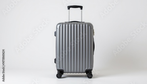 Travel gear stylish silver suitcase minimalist studio setting product photography clean environment front view travel essentials