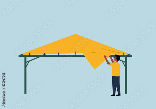 Installing Yellow Tarp on the Structure for Outdoor Shade