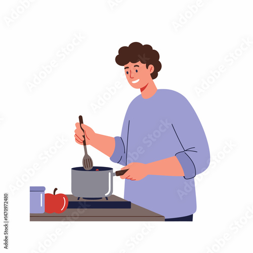Happy man cooking in the kitchen at home