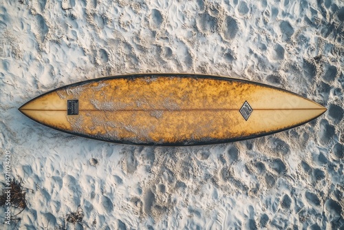 Vintage surfboard on sandy beach