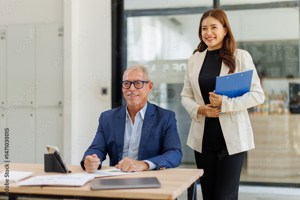 Obraz premium Team of confident business people point to graphs and charts to analyze market data, balance sheet, account, net profit to plan new sales strategies to increase production capacity. 