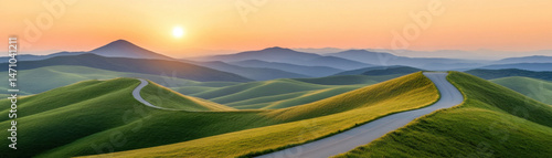 serene countryside road winds through lush green hills under vibrant sunset, creating peaceful atmosphere