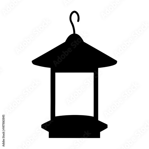 Silhouette of a classic hanging bird feeder perfect for outdoor enjoyment