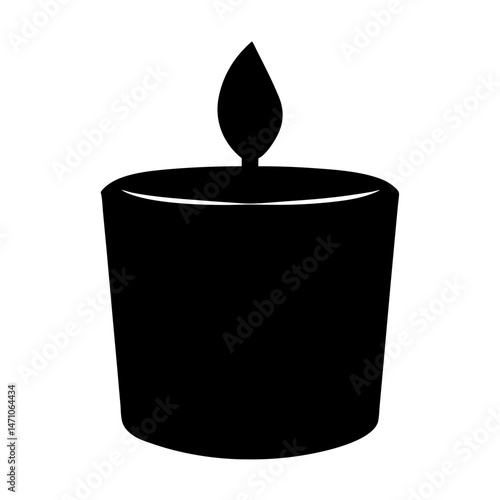 Single black candle in a small decorative holder giving off light