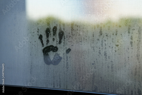 Handprint Marked On Condensation Window