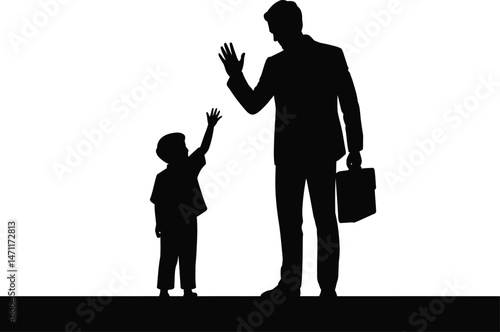 Silhouette of a father and son high fiving as the dad leaves for work