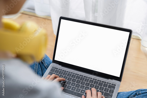 woman using a computer laptop with a blank screen, for putting advertising to promote