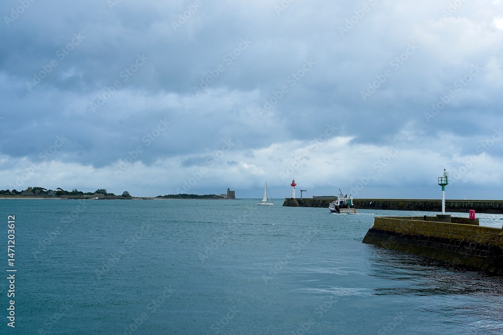 Saint-Vaast-la-Hougue France - 22 September 2023 - The pier of the harbor of Saint-Vaast-la-Hogue in Normandy France Saint-Vaast-la-Hougue France - 22 September 2023 - The pier of the harbor of Saint-Vaast-la-Hogue in Normandy France